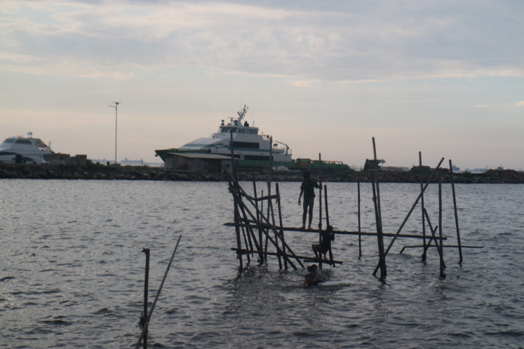 Way of life: Children from fishing neighborhoods in Marunda, North Jakarta, play near the Marunda Port on July 13.