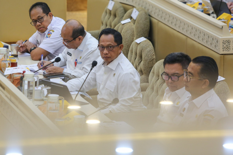 Home Minister Tito Karnavian (center) attends a meeting with the House of Representatives Commission II overseeing home affairs at the Senayan legislative complex in Jakarta on July 16, 2025.
