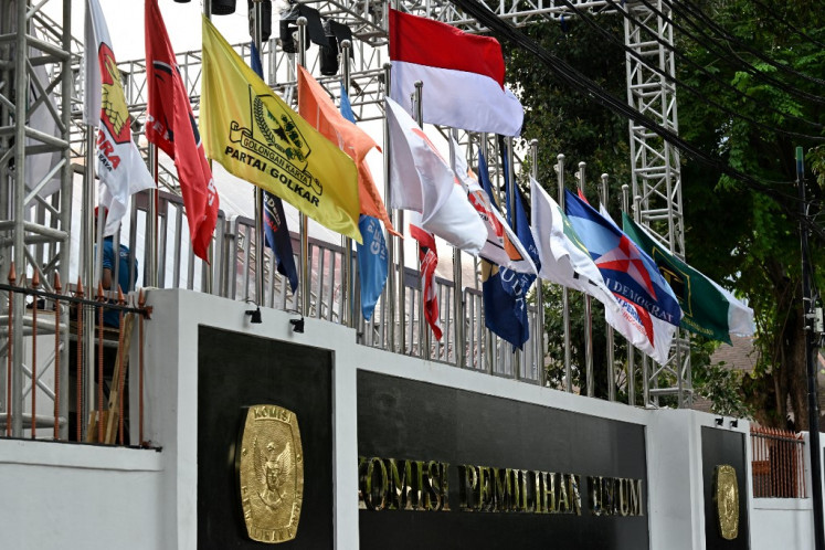 Flags of political parties are seen at the office of the General Elections Commission (KPU) in Jakarta on Nov. 13, 2023, ahead of the announcement of the 2024 presidential election candidates.