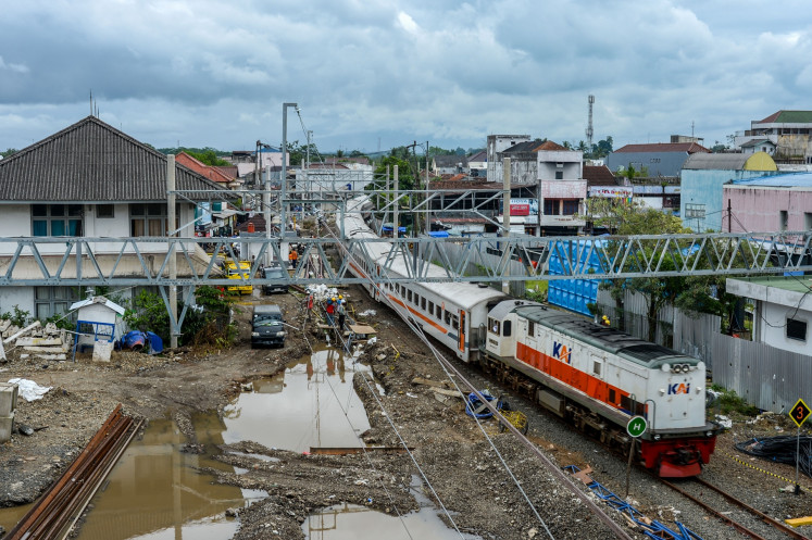 A local train passes through Rangkasbitung on June 18 in Lebak regency, Banten.