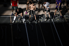 Beefing up: Participants compete in the “sled pull“ event on April 18 during the Hyrox fitness race at the Grand Palais venue in Paris.