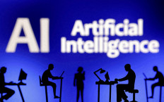 Figurines with computers and smartphones are seen in front of the words “Artificial Intelligence“ in this illustration created on Feb. 19, 2024.