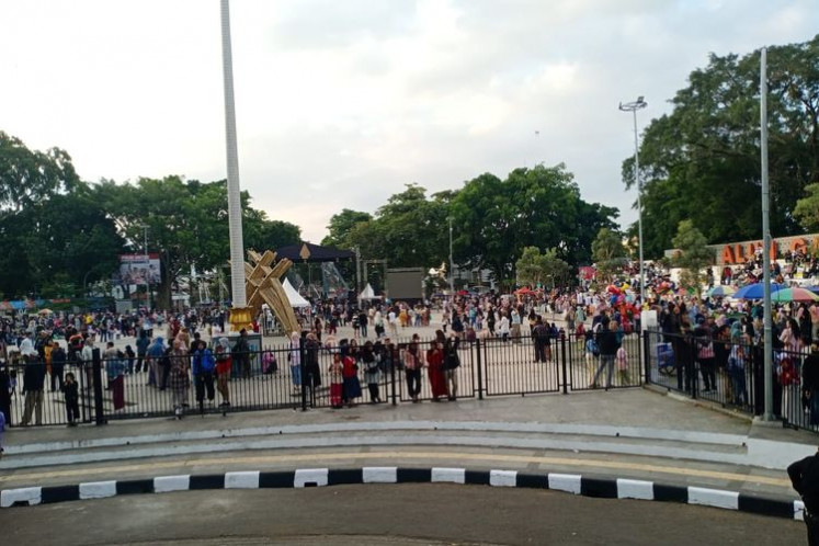 People are seen at the town square of Garut, West Java, on July 18 after a deadly stampede at a public event to celebrate the wedding of Garut Deputy Regent Putri Karlina and Maula Akbar Mulyadi Putra, the eldest son of West Java Governor Dedi Mulyadi.