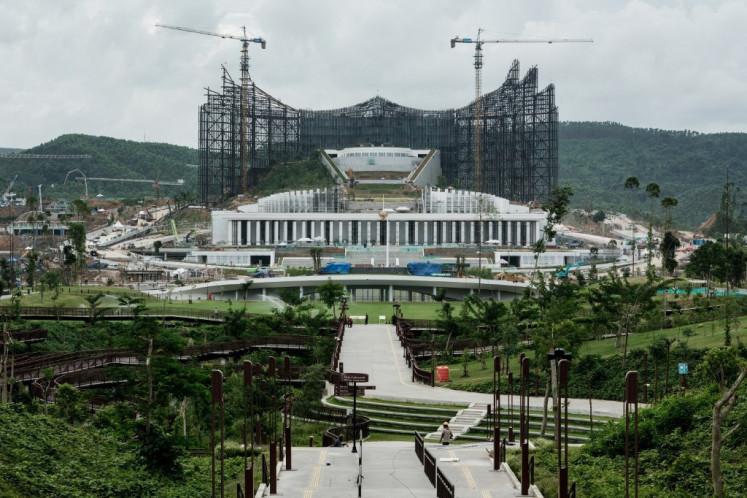 Work continues on Indonesia's new Presidential Palace in the future capital city of Nusantara, in Penajam Paser Utara, East Kalimantan, on July 11, 2024. The new city is scheduled to begin operating as the country's new political center on Aug. 17, 2024, during Indonesia's 79th Independence Day. Work continues on Indonesia's new Presidential Palace in the future capital city of Nusantara, in Penajam Paser Utara, East Kalimantan, on July 11, 2024. The new city is scheduled to begin operating as the country's new political center on Aug. 17, 2024, during Indonesia's 79th Independence Day. (Photo by Yasuyoshi CHIBA/AFP) (AFP/Yasuyoshi Chiba)