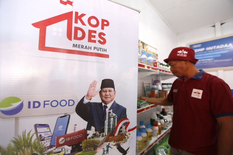 An employee arranges a shelf of vegetable seeds on July 21, 2025, at the Hutadaa rural cooperative in Gorontalo regency, Gorontalo, one of 80,000 co-ops launched on July 21 under President Prabowo Subianto’s Red-and-White Cooperative (KMP) program.
