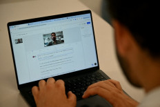 History repeating itself?: A person uses AI software on a laptop during the opening of the new Synthesia headquarters on July 2 in Central London.