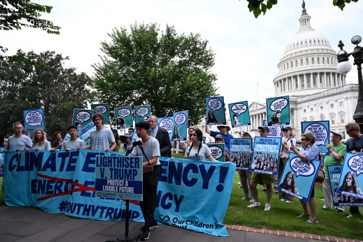 Our Children's Trust hosts a press conference on July 16 pushing to support a stable climate and to back plaintiffs suing the Donald Trump administration at the United States Capitol in Washington, DC.