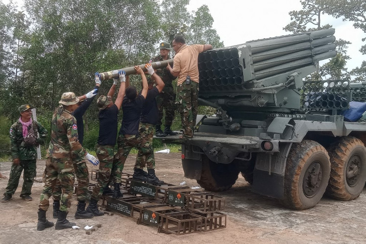 Cambodian soldiers reload the BM-21 multiple rocket launcher in Preah Vihear province on July 24, 2025. Thailand launched air strikes on Cambodian military targets on July 24 as Cambodia fired rockets and artillery, killing a civilian, in a dramatic escalation of a long-running border row between the two neighbors. 