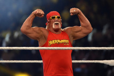 Wrestling legend Hulk Hogan greets the crowd during the World Wrestling Entertainment (WWE) Crown Jewel pay-per-view at the King Saud University Stadium in Riyadh on November 2, 2018.