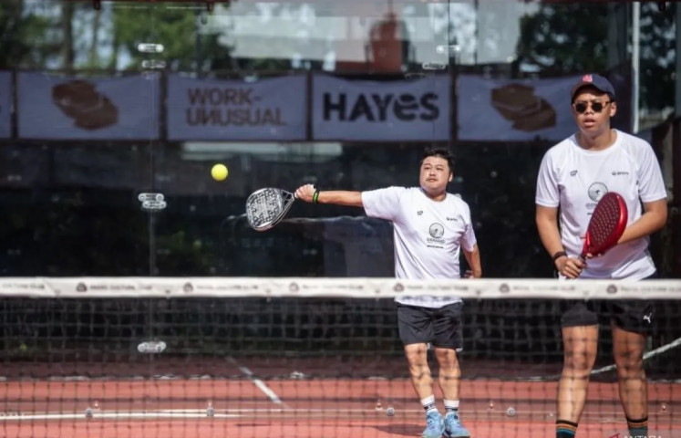 Solid foothold: A padel player (left) hits a return on Feb. 8, 2025 during a tournament at the Padel Culture Club in Bandung, West Java. The racket sport, which combines elements of squash and tennis and traces its origins to Mexico, has been gaining popularity since it entered Indonesia via Bali around 2020.