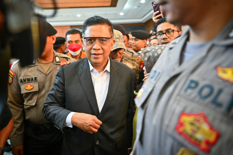Indonesian Democratic Party of Struggle (PDI-P) secretary-general Hasto Kristiyanto exits the courtroom on Friday after his trial at the Jakarta Corruption Court. The panel of judges found him guilty of bribery and sentenced him to three-and-a-half years in prison.
