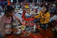Evacuees displaced by the ongoing conflict between Thailand and Cambodia rest on July 26, 2025, at an evacuation center in the Thai border province of Si Sa Ket. 