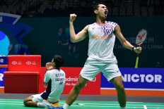 Indonesia's Fajar Alfian (right) and Muhammad Shohibul Fikri celebrate after winning the men's doubles final against Malaysia's Aaron Chia and Soh Wooi Yik at the China Open badminton tournament in Changzhou, in China's eastern Jiangsu province on July 27, 2025.