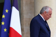 French Prime Minister Francois Bayrou leaves following the weekly cabinet meeting at the Elysee Palace in Paris on July 16, 2025.