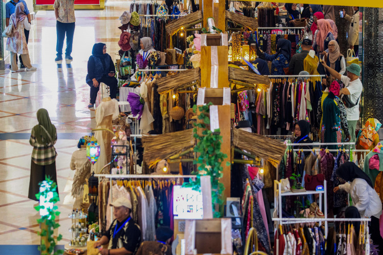 Visitors view creative industry products on July 17 at the Sunda Karsa Fest event at Trans Studio Mall in Bandung, West Java.