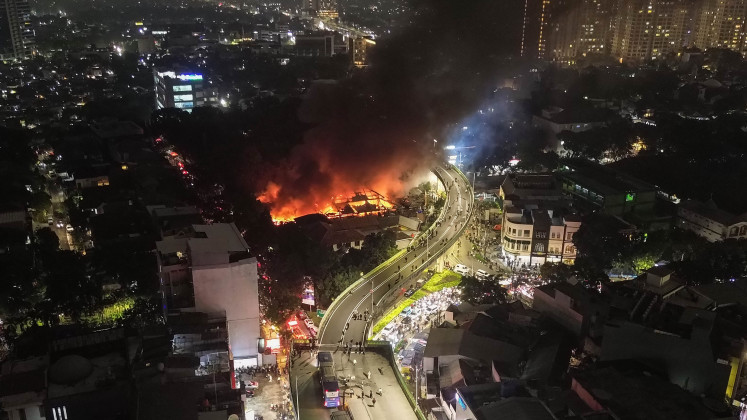 Devastating loss: Fire rages through Taman Puring Market on Monday evening in Kebayoran Baru, South Jakarta.