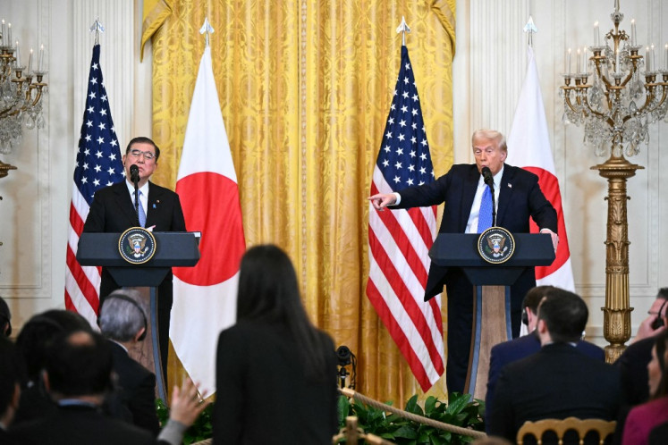 Japanese Prime Minister Shigeru Ishiba (left) and United States President Donald Trump take questions from reporters on Feb. 7, 2025, during a joint press conference in the East Room of the White House in Washington, DC.