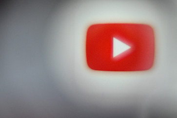 This illustration photograph taken on December 22, 2023, shows the logo of video sharing portal YouTube displayed on a smartphone screen, in Frankfurt am Main, western Germany.
