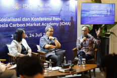 William Sabandar (right), chief operating officer of the Indonesian Business Council (IBC), talks about the carbon market on July 24, 2025, during a panel discussion in Jakarta with Natalia Rialucky Marsudi (left), founder and CEO of Fairatmos, and Paul Butarbutar, executive director of the Indonesia Center for Renewable Energy Studies (ICRES).
