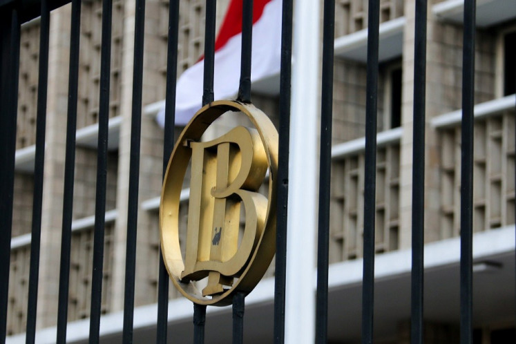 The gatekeeper: The logo of Bank Indonesia marks the central bank’s gate on Jl. Thamrin in Central Jakarta. The bank has cut its seven-day reverse repo rate several times to help the country recover from the crisis inflicted by the COVID-19 pandemic. 