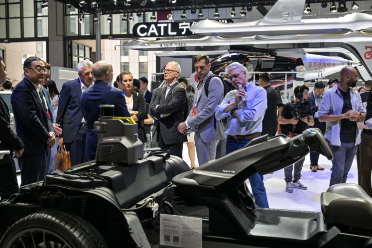 Leaps and bounds: People visit the booth of Chinese battery giant CATL during the 21st Shanghai International Automobile Industry Exhibition on April 24 at the National Exhibition and Convention Center in Shanghai.