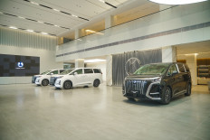 DENZA’s premium electric 7 seater MPV, the DENZA D9, is seen on display in the company’s showroom.  (Courtesy of DENZA)