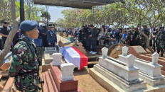 The coffin of Air Vice Marshal (posthumous) Fajar Adriyanto is placed before a military burial ceremony on Monday, Aug. 4, at Monyetan public cemetery in Probolinggo city, East Java. Fajar died in a microlight aircraft crash on Sunday, Aug. 3 in Ciampea, Bogor regency, West Java.