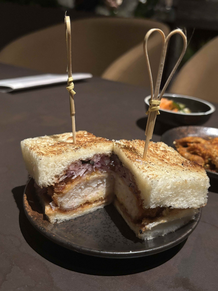 Shrimp, chicken and coleslaw come layered between soft bread in Junsei’s elevated take on the classic katsu sando.