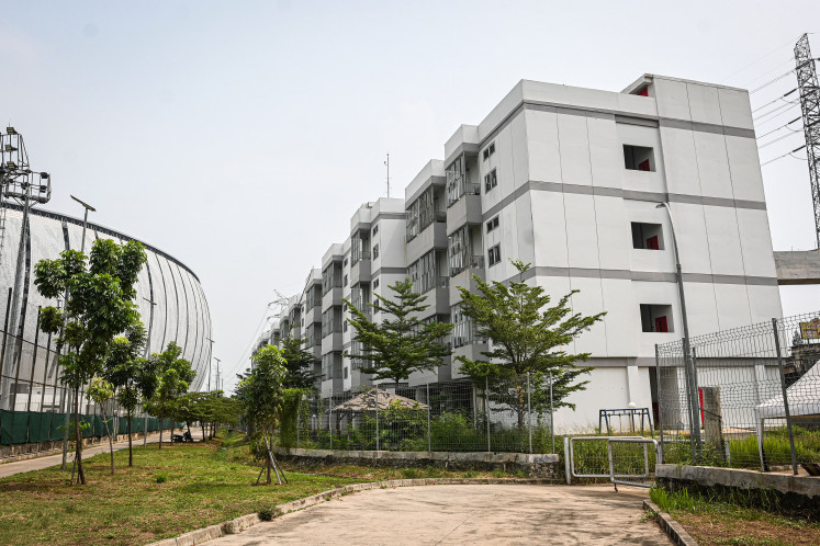 The picture shows Kampung Susun Bayam (KSB) apartment building that sits next to the Jakarta International Stadium (JIS) in North Jakarta on July 28, 2025. 