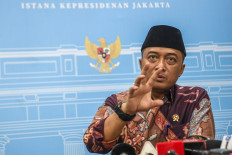 State Secretary Prasetyo Hadi talks to journalists on July 25, 2025, during a press briefing at the Presidential Palace in Jakarta.