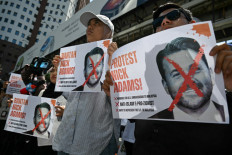 Malaysian protesters display placards on July 18 during a demonstration against the United States envoy nominee Nick Adams outside the US embassy in Kuala Lumpur.