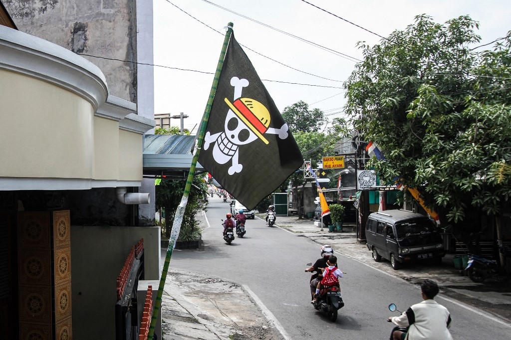A pirate flag from the Japanese anime One Piece, installed a week earlier to follow an internet trend using the symbol to criticise government policies, is seen at a house in Solo, Central Java, on August 7, 2025.