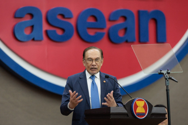 Malaysia's Prime Minister Anwar Ibrahim delivers a speech on July 29 at the ASEAN Secretariat in Jakarta. 