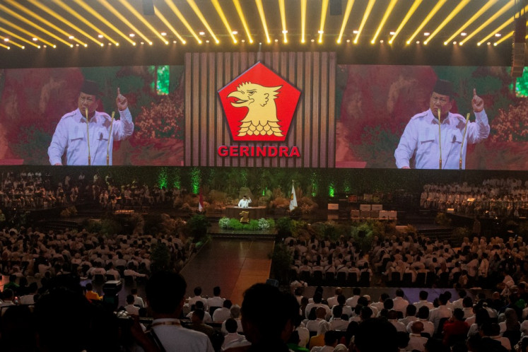 President Prabowo Subianto, who also serves as the chairman of Gerindra Party, is seen on a large screen as he speaks during the party's 17th anniversary in Bogor, West Java, on Feb. 15, 2025.