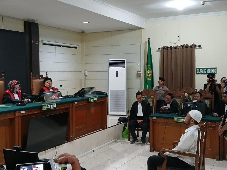 Second Adj. Insp. Robig Zaenudin, a narcotics officer with the Semarang Police, attends his sentence hearing at the Semarang District Court on Aug. 8, 2025, in the Central Java capital. The court sentenced him to 15 years in prison and a fine of Rp 200 million (US$12,229) for killing GRO, 17, and injuring two other teenagers during a shooting incident in Semarang on Nov. 24, 2024.