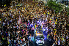 Protesters gather in a demonstration organized by the families of the Israeli hostages taken captive in the Gaza Strip since October 2023 calling for action to secure their release outside the Defense Ministry headquarters in Tel Aviv on August 9, 2025.