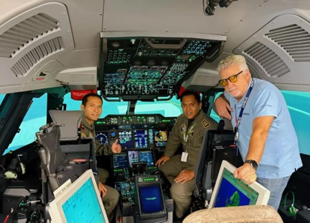 Flying high: Two Indonesian Air Force pilots pose with their instructor (right) in the cockpit of an Airbus A400M Atlas transport aircraft in Seville, Spain, in this undated photo. Four Indonesian Air Force pilots are undergoing the type rating course at Airbus's International Training Center (ITC) from July 16 to Oct. 25.