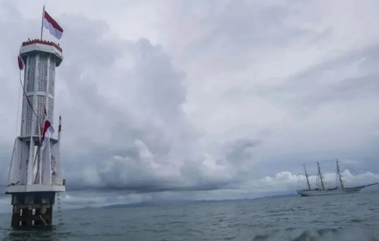 Indonesian Navy training vessel KRI Bima Suci sails past a border marker on Aug. 13, 2021, in the Ambalat maritime region off Nunukan regency, North Kalimantan.