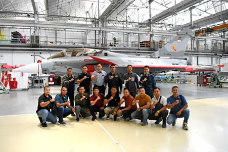 State-of-the-art: Indonesian Air Force pilots and technicians pose in front of the country's first Dassault Rafale B jet fighter at the Dassault production line in Merignac, near Bordeaux, France, in this undated photo. Four pilots and 12 technicians are taking courses in France on how to operate and maintain Rafale jet fighters. 