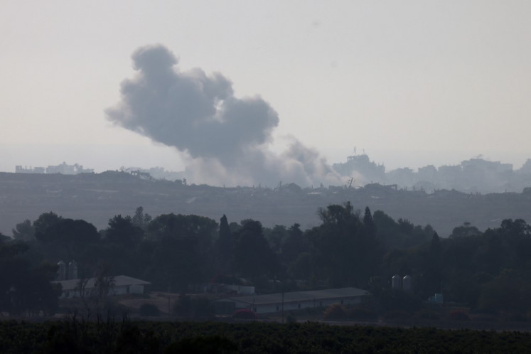 This picture taken from a position on the Israeli border with the Gaza Strip, shows smoke rising during an Israeli strike on the besieged Palestinian territory on August 10, 2025. 