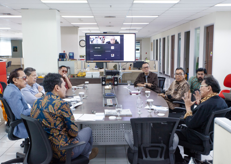 Understanding Indonesia: Ilham Aidit (right), son of Indonesian Communist Party (PKI) leader D.N. Aidit, speaks during a discussion hosted by The Jakarta Post at the Post’s building in Jakarta on Aug. 6, 2025. The event, held to mark Indonesia’s 80th Independence Day, was also attended by (counterclockwise) historian Asvi Marwan Adam, the Post CEO Judistira Wanandi, Centre for Strategic and International Studies (CSIS) cofounder Jusuf Wanandi (on screen), former Army Deputy Chief of Staff Lt. Gen. (Ret.) Kiki Syahnakri, human rights activist Marzuki Darusman, former Air Force Chief of Staff Air Chief Marshal (Ret.) Chappy Hakim and the Post chief editor M. Taufiqurrahman. 
JP/Okky Ardya