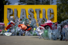 An artwork by Canadian artist, activist, and photographer Benjamin Von Wong entitled “The Thinker's Burden“ a 6-meter-tall sculptural remix of Rodin's iconic Thinker, which is being created for the Plastics Treaty Negotiations is seen in front of the United Nations Offices in Geneva on August 13, 2025. Negotiators from 184 countries remained riven on how to curb plastic pollution, less than 36 hours before they were slated to deliver a binding global treaty.