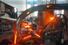 Conserving resources: Employees work in a workshop that recycles copper on July 11 in Anqing, in China's eastern Anhui province. 