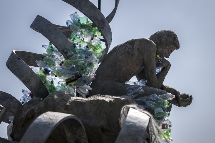 Stumped: An artwork by Canadian artist, activist and photographer Benjamin Von Wong entitled “The Thinker's Burden“, a 6-meter-tall sculptural reimagining of Rodin's iconic "Thinker", created for the Plastics Treaty Negotiations, is seen on Wednesday in front of the United Nations Offices in Geneva, Switzerland. Negotiators from 184 countries remained riven on how to curb plastic pollution, less than 36 hours before they were slated to deliver a binding global treaty.