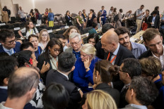 Delegates speak together after talks on a global treaty on combating plastic pollution were extended an extra day, late on August 14, 2025 in Geneva. Talks on striking a global treaty on combating plastic pollution were extended an extra day into August 15 but with no clear endgame in sight. Ten days of negotiations at the United Nations in Geneva were due to wrap up on August 14, 2025, but with 23 minutes of the day left, the talks were prolonged.