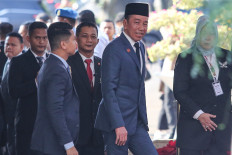 Former president Joko "Jokowi" Widodo arrives at the Senayan Legislative Complex in Central Jakarta on Aug. 15, 2025 to attend President Prabowo Subianto's first State of the Nation address.