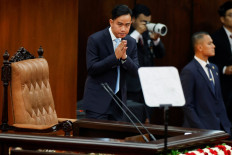 Vice President Gibran Rakabuming Raka gestures before President Prabowo Subianto delivers his annual State of the Nation address during the People's Consultative Assembly (MPR) plenary meeting at the Senayan legislative complex in Central Jakarta on Aug. 15, 2025, ahead of the country's 80th Independence Day.