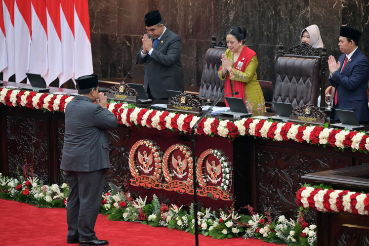 President Prabowo Subianto (left) greets People's Consultative Assembly (MPR) Speaker Ahmad Muzani (second left), House of Representatives Speaker Puan Maharani (second right) and Regional Representatives Council (DPD) Speaker Sultan Bachtiar Najamudin (right) before he delivers his annual State of the Nation address during the plenary meeting at the Senayan legislative complex in Jakarta on Aug. 15, 2025, ahead of the country's 80th Independence Day.