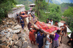 Mourners carry the coffins of flood affected victims after flash floods in Naryean Behaak village, some 36 kilometers north from Muzaffarabad, the capital of Pakistan-administered Kashmir on Aug. 15, 2025. The death toll from heavy monsoon rains that have triggered landslides and flash floods across northern Pakistan has risen to at least 194 people in the past 24 hours, the disaster authority said on Aug. 15.