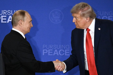 US President Donald Trump (right) and Russian President Vladimir Putin shake hands at the end of a joint press conference after participating in a US-Russia summit on Ukraine at Joint Base Elmendorf-Richardson in Anchorage, Alaska on August 15, 2025.
